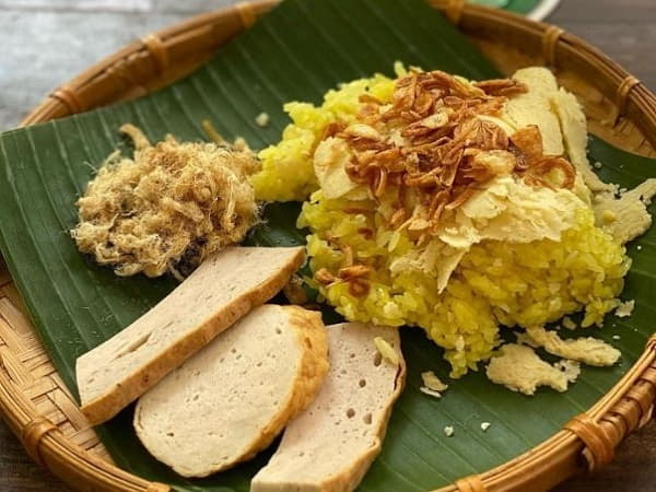 Mê thấy ăn xôi bị rơi